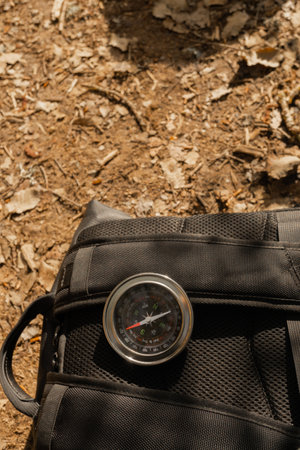 close-up of a compass on a backpack on a hiking day in the mountainsの写真素材