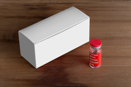 Vials box with a vial at front on wooden board. editable mock-up series template ready for your...