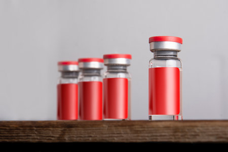 Medical vial for injection isolated on gray background. Medicine and healthcare concept. editable mock-up series template ready for your design. labels selection path included.の写真素材