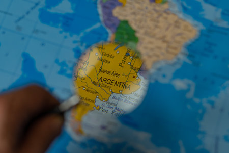 colorful view of argentina magnified with a magnifying glass, blurred backgroundの写真素材