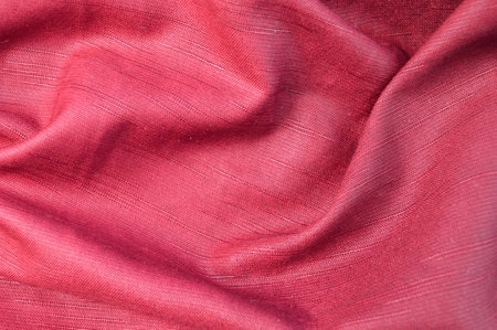 Wave pattern of red cloth texture background. Copy space for the text