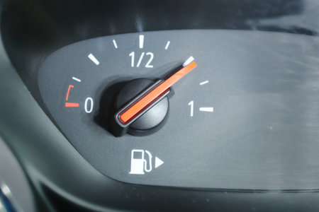 Close-up of a fuel gauge showing a three-quarters full fuel tank in a car.の写真素材