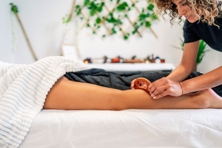 Leg massage with wood therapy techniqueの写真素材