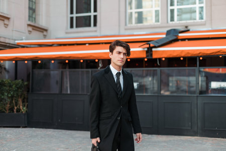 A shallow focus shot of a serious young Caucasian guy dressed professionallyの写真素材