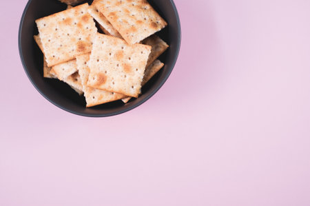 A top view shot of bread chips on a purple backgroundの写真素材