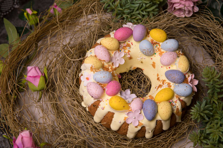 An Easter cake decorated with colorful eggsの写真素材