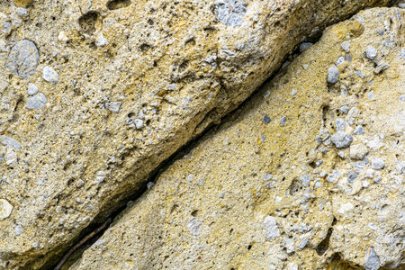 A closeup of naturally textured stone surfaceの写真素材