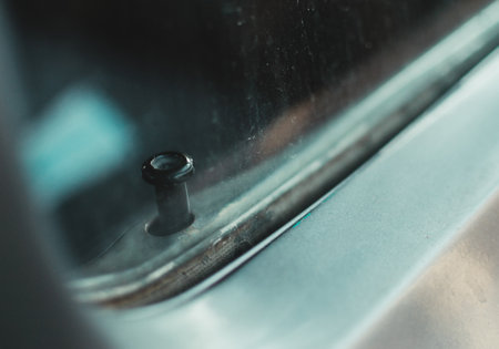 A closeup of an old vintage car's door lockの写真素材