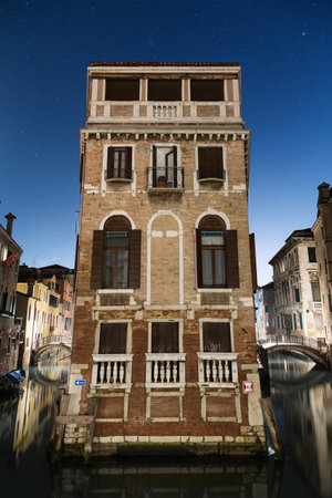 A vertical shot of the facade of an old apartment buildingの写真素材