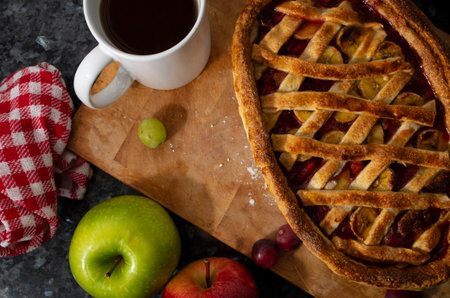 A high angle shot of delicious homemade apple pie and a cup of coffeeの写真素材