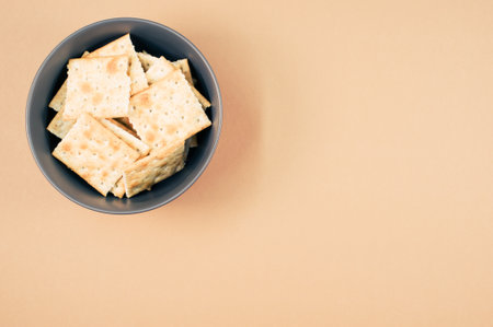 A closeup shot of bread chips on a coralbackgroundの写真素材