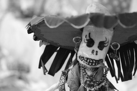 A greyscale shot of a traditional doll with traditional costumeの写真素材