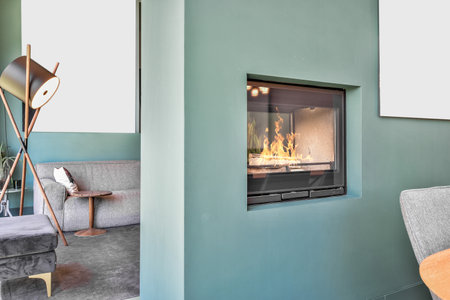 The fireplace in the wall in the living room of a modern apartmentの写真素材