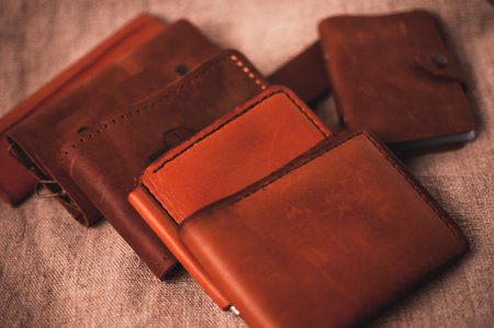A closeup shot of brown leather wallets on a table