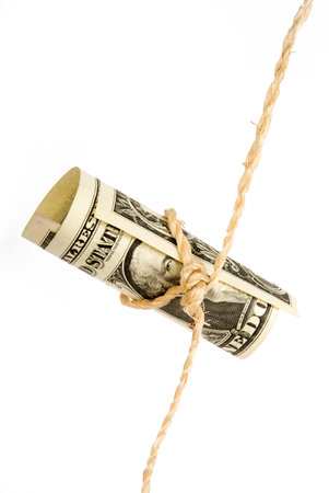 Shoestring budget dollar.  string or twine tied in a bow isolated