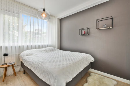 A modern room with furniture and the bright light coming from the window