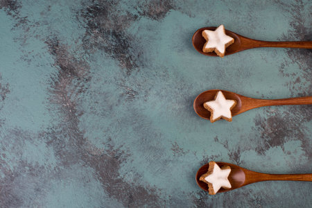 Cinnamon stars, traditional german christmas bakery, gingerbread with white sugar glaze, empty copy...