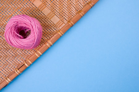 A high angle shot of a delicious donut on a woven fabric on a blue surfaceの写真素材