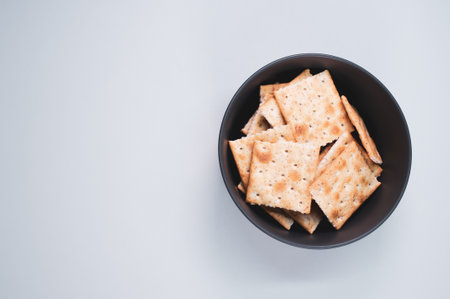 A top view shot of bread chips on a white backgroundの写真素材