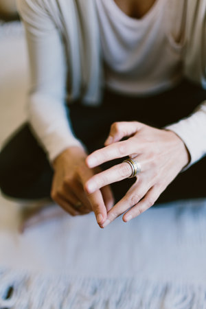 A vertical closeup of a Caucasian female counting on her fingersの写真素材