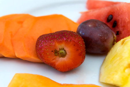 Breakfast fruit in hotel Guatemala, tropical fruits, strawberry, grapes, watermelon, melon, papaya and pineapple in Guatemala.の写真素材
