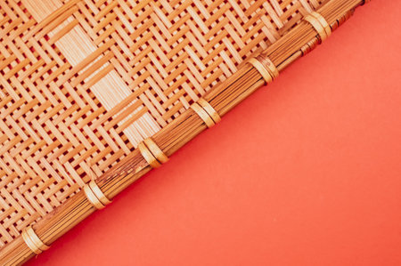 A high angle shot of a woven fabric on a red surfaceの写真素材