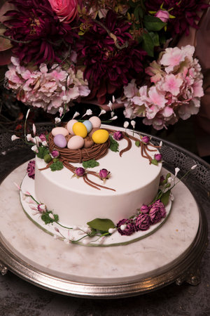 An Easter cake decorated with colorful eggs