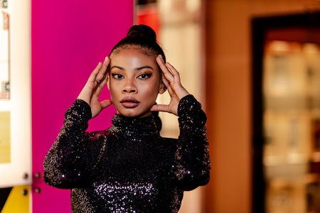 A selective focus shot of a Black young female model from Grenada adult posing for a photo