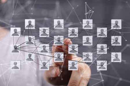 A male's hand pointing to illustrated telecommunication concept with abstract network structureの写真素材