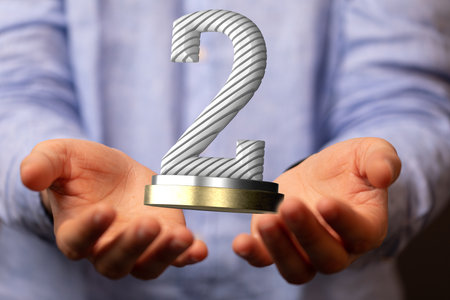 An illustration of a second-place trophy or two years anniversary concept in handsの写真素材