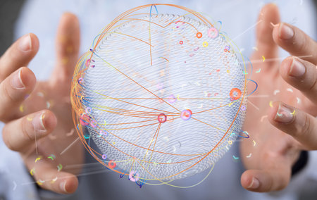 A businessman holding a digital global network symbolの写真素材
