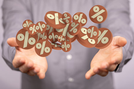 A 3D render of floating percentage symbols over a businessman's handsの写真素材