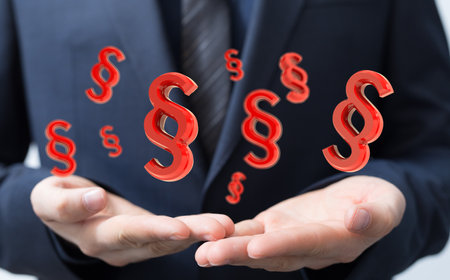 A 3D render of floating paragraph law and justice symbols over a lawyer's hands