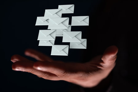 A person presenting the virtual projection of email marketing concept with digital envelopesの写真素材