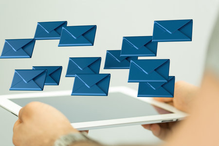 A person presenting the virtual projection of email marketing concept with digital envelopesの写真素材