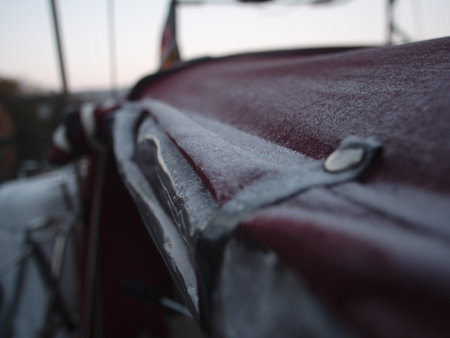 A shallow focus shot of the frosted tent of a sailing yacht in a winter conditionsの写真素材