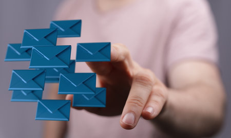 A 3D rendering of mail icons with a real person in the background - email marketing conceptの写真素材