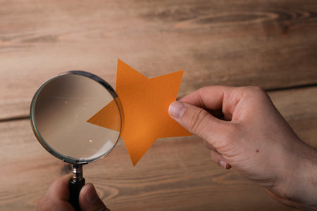 A closeup shot of a star on wooden background