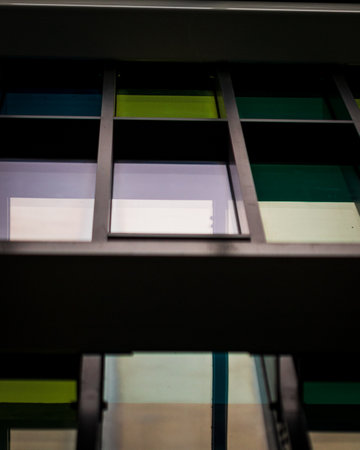 A low-angle shot of a modern corporate building with glass windowsの写真素材