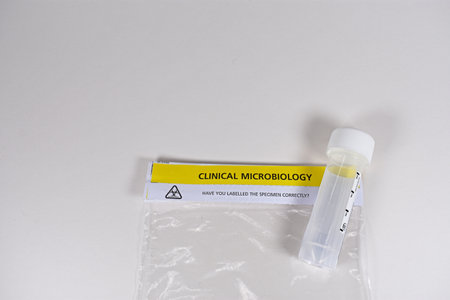 Clinical Microbiology specimen plastic bag with sample test container isolated on white with text copy space backgroundの写真素材
