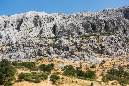 A scenic landscape of limestone formations at Sierra de Camarolos, Hondonero, Andalusia, Spainの写真素材