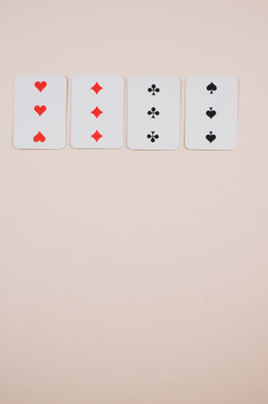 A vertical shot of cards for a game in a coral backgroundの写真素材