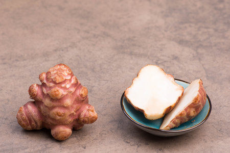 Jerusalem artichoke, fresh vegetable, empty copy space for textの写真素材