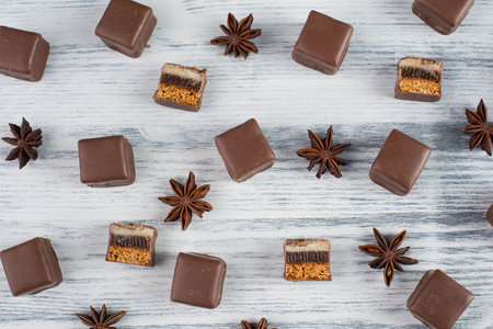 A closeup of german traditional Christmas Domino chocolates on a red table clothの写真素材