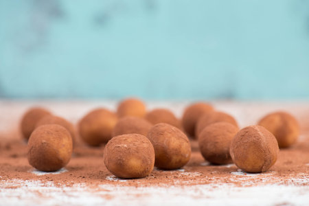 Marzipan potatoes, in german called Marzipankartoffeln, with cacao powder, sweets for christmas, empty copy spaceの写真素材