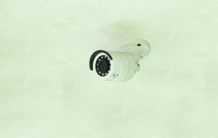 white cctv camera mounted on the ceiling of the houseの写真素材