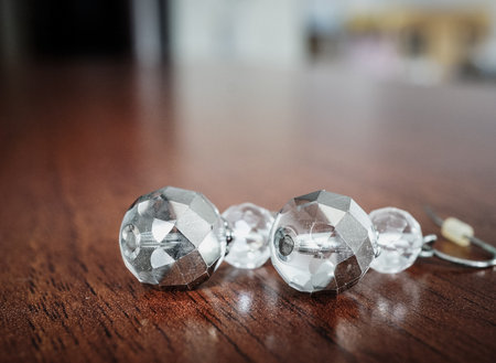 A view of shiny crystals for decoration on a wooden surfaceの写真素材