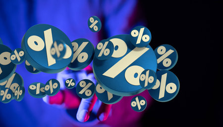 A hand holding 3D percent signs in the air