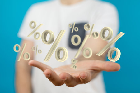 A person presenting the virtual projection of sale or discount concept through the percent symbolsの写真素材