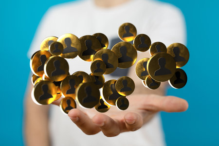 A businessman holding the virtual 3D network icons symbolizing cooperation and teamworkの写真素材